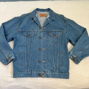 Vintage LEVI STRAUSS & CO Type 3 Denim Trucker Jacket with a red tab